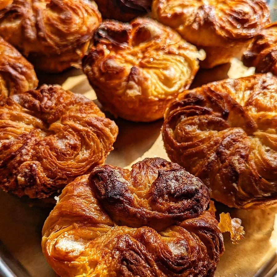 Golden-brown fried pastries with flaky, crispy layers